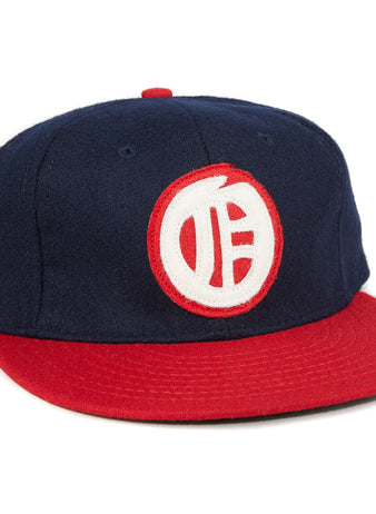 The EFF Oakland Oaks 1948 Vintage Ballcap is a navy blue cap with a red brim and button, featuring a white and red circular logo on the front—perfect for Pacific Coast League fans.