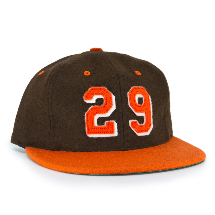 The Ebbets Field Flannels Satchel Paige 1952 Signature Series Ballcap is a vintage brown wool cap with an orange brim and “29” in orange with a white outline, honoring the legendary Negro Leagues pitcher.