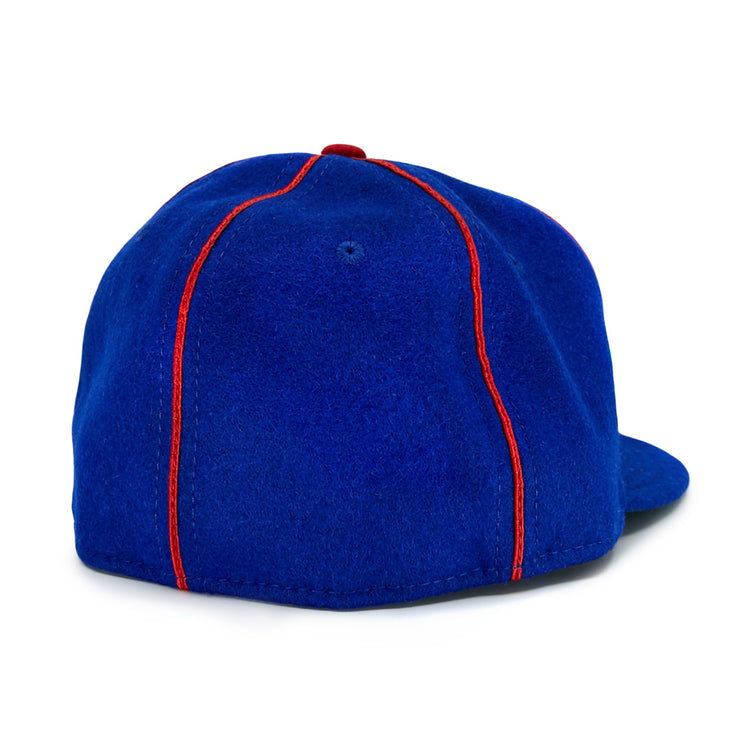 The EFF Phoenix Senators 1930 Vintage Ballcap in royal blue wool features bright red vertical stitching, a red top button, and is viewed from the back, echoing the Arizona State League teams classic style.