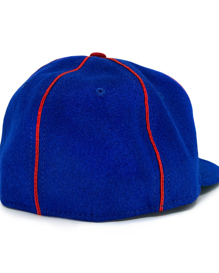 The EFF Phoenix Senators 1930 Vintage Ballcap in royal blue wool features bright red vertical stitching, a red top button, and is viewed from the back, echoing the Arizona State League teams classic style.