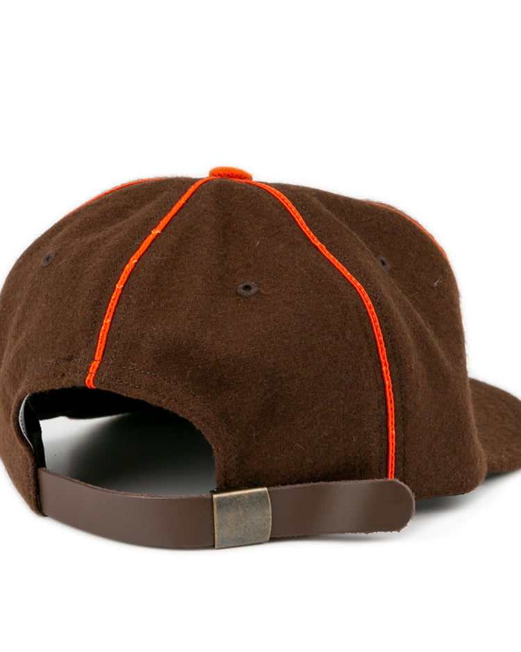 The EFF Pocatello Bannocks 1952 Vintage Ballcap is shown from the back, highlighting orange seam stitching and an adjustable leather strap with a metal buckle.