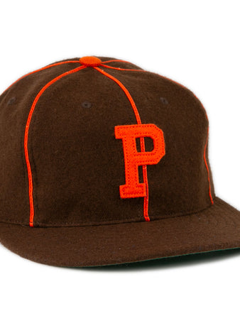 The EFF Pocatello Bannocks 1952 Vintage Ballcap is a brown wool baseball hat with orange piping, an orange top button, and a large orange “P” embroidered on the front.
