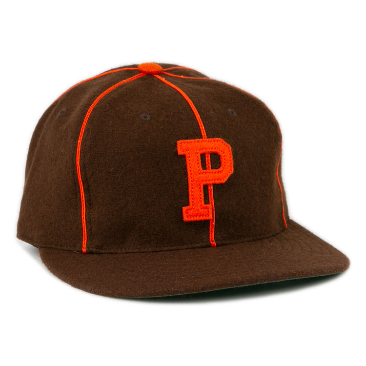 The EFF Pocatello Bannocks 1952 Vintage Ballcap is a brown wool baseball hat with orange piping, an orange top button, and a large orange “P” embroidered on the front.