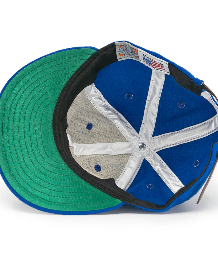 The EFF Puerto Rico Marlins 1961 Vintage Ballcap is shown from underneath, featuring a green underbrim, white lining, blue panels with ventilation holes, and a visible Made in USA label.