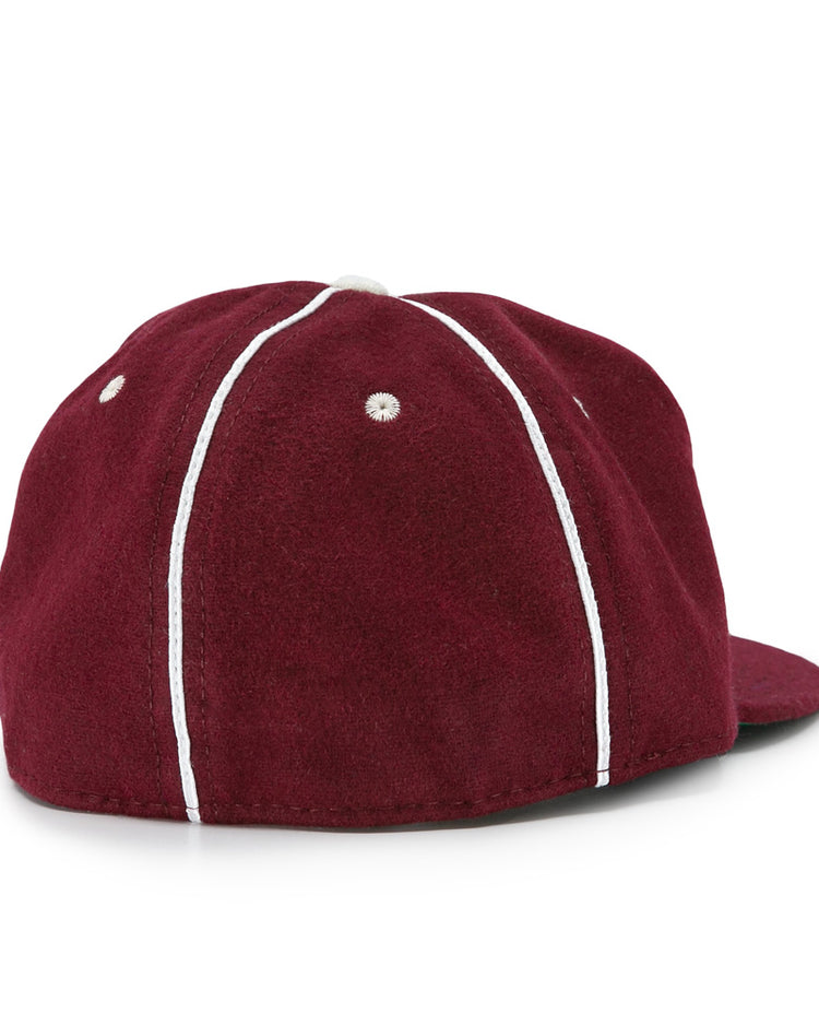 The EFF Quebec Athletics 1941 Vintage Ballcap is shown from the back in maroon wool, featuring white vertical piping and stitched eyelets on each panel.