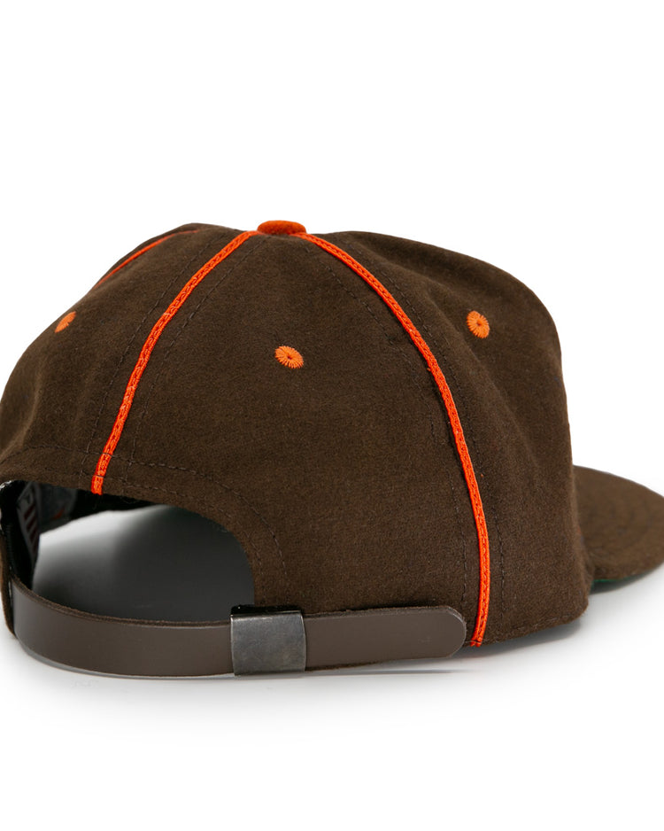 The EFF San Antonio Missions 1939 Vintage Ballcap features brown fabric with orange stitching, retro accents, and an adjustable strap with a metal clasp, inspired by the classic 1939 ballcap and shown from the back.