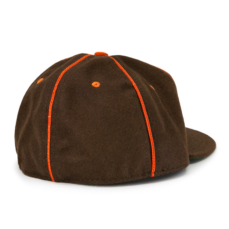 The EFF San Antonio Missions 1939 Vintage Ballcap is dark brown with orange stitching and eyelets, seen from the back and side. It features a flat brim, no visible logo or strap, reflecting classic 1939 style.