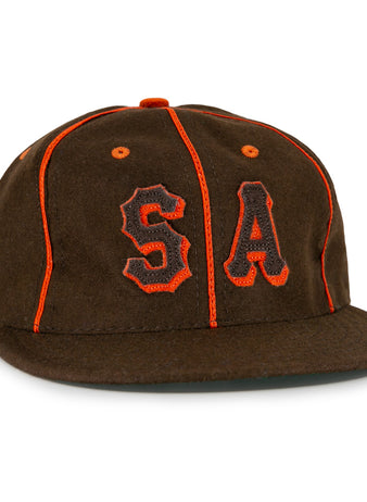 The EFF San Antonio Missions 1939 Vintage Ballcap is a brown wool cap with orange piping and bold orange and black embroidered S and A, styled after the historic teams original design.