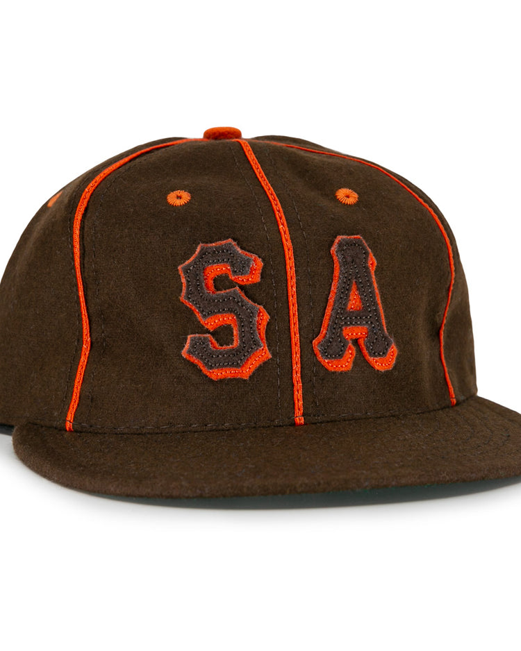 The EFF San Antonio Missions 1939 Vintage Ballcap is a brown wool cap with orange piping and bold orange and black embroidered S and A, styled after the historic teams original design.
