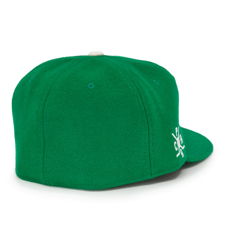 The EFF Seattle Metropolitans 1917 Vintage Ballcap is a green wool cap shown from the back, with white side embroidery and a small white top button, inspired by classic Pacific Coast Hockey Association style.