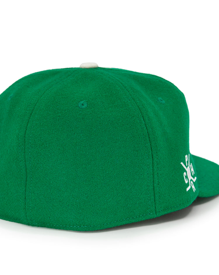 The EFF Seattle Metropolitans 1917 Vintage Ballcap is a green wool cap shown from the back, with white side embroidery and a small white top button, inspired by classic Pacific Coast Hockey Association style.