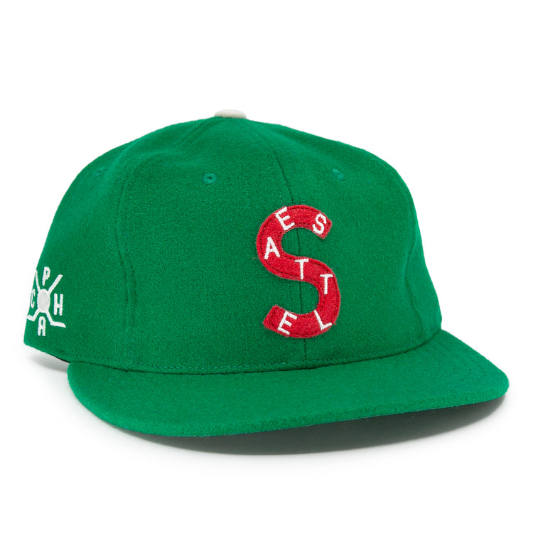 The EFF Seattle Metropolitans 1917 Vintage Ballcap is a green wool hat with a red and white S logo made of the letters A, E, S, T, E, L. White-embroidered letters A, P, H, and A appear on the side—vintage Pacific Coast Hockey Association style.
