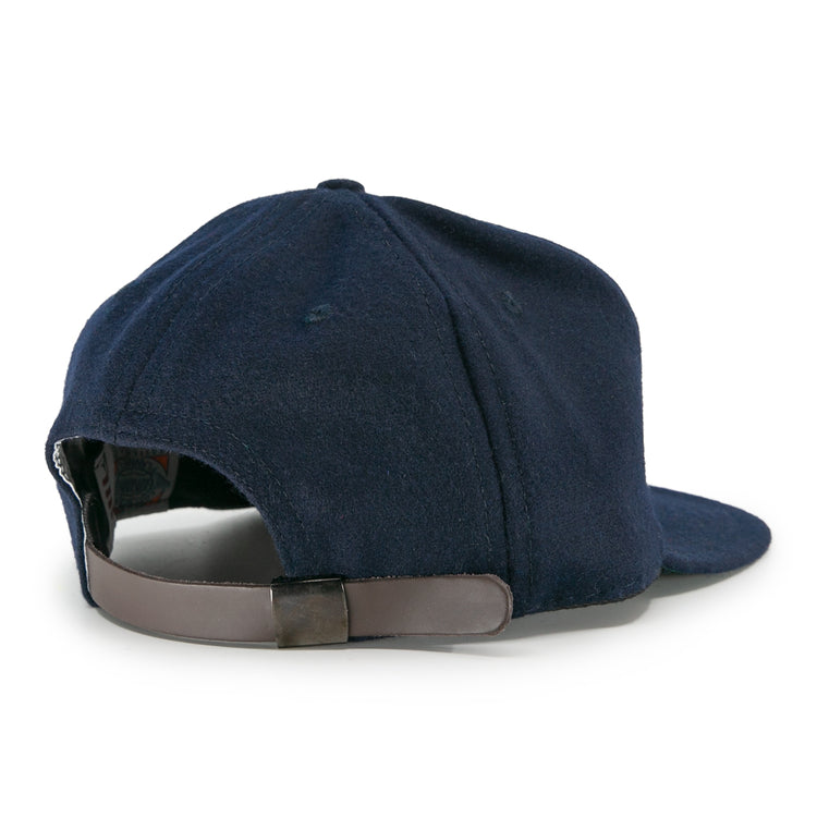 The EFF San Francisco Missions 1935 Vintage Ballcap in navy blue is shown from the back, featuring a brown adjustable leather strap with a metal clasp, visible stitching, and a slightly curved brim.