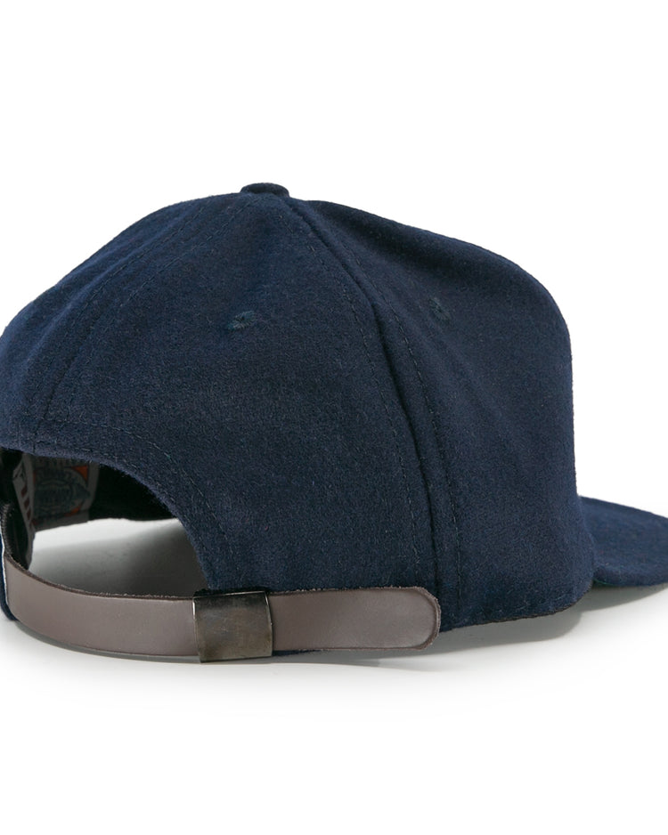 The EFF San Francisco Missions 1935 Vintage Ballcap in navy blue is shown from the back, featuring a brown adjustable leather strap with a metal clasp, visible stitching, and a slightly curved brim.