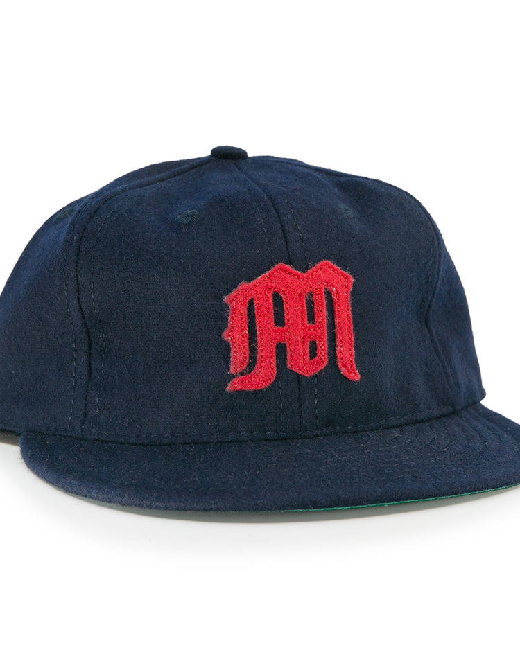 The EFF San Francisco Missions 1935 Vintage Ballcap is a navy blue wool cap featuring a red embroidered M logo, inspired by the original teams classic design.