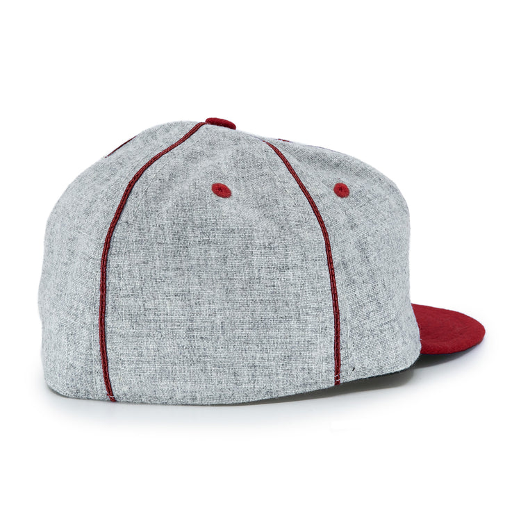 The EFF San Francisco Post Office 1939 Vintage Ballcap is shown from the back and slightly to the side on a white background, featuring gray fabric with red stitched seams, red ventilation eyelets, and a red brim.