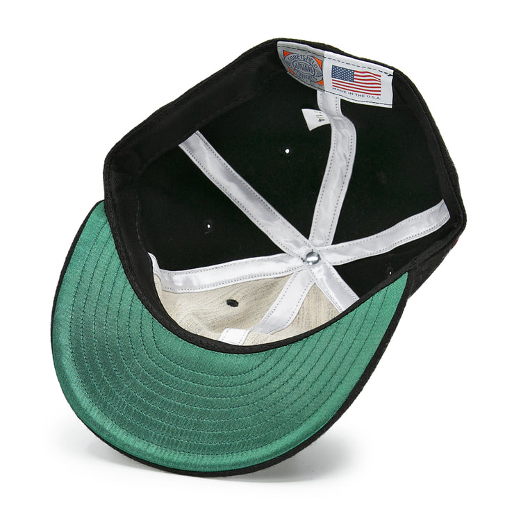 The underside of the EFF San Francisco Seals 1963 Vintage Ballcap features a green brim, white sweatband, interior stitching, and a Made in USA label with an American flag—echoing classic memorabilia.