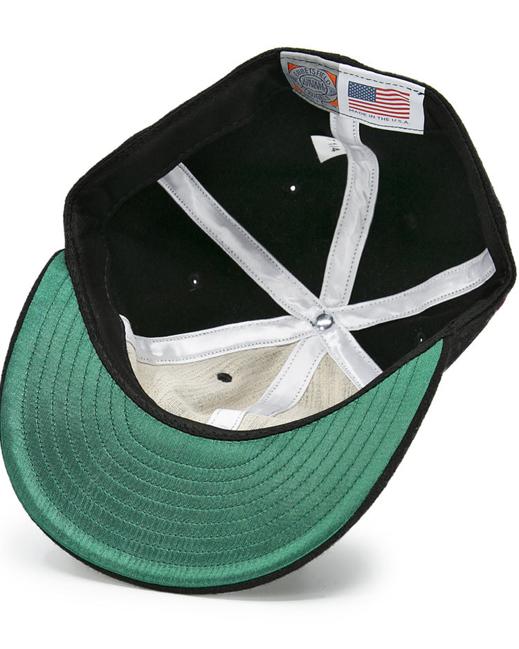 The underside of the EFF San Francisco Seals 1963 Vintage Ballcap features a green brim, white sweatband, interior stitching, and a Made in USA label with an American flag—echoing classic memorabilia.