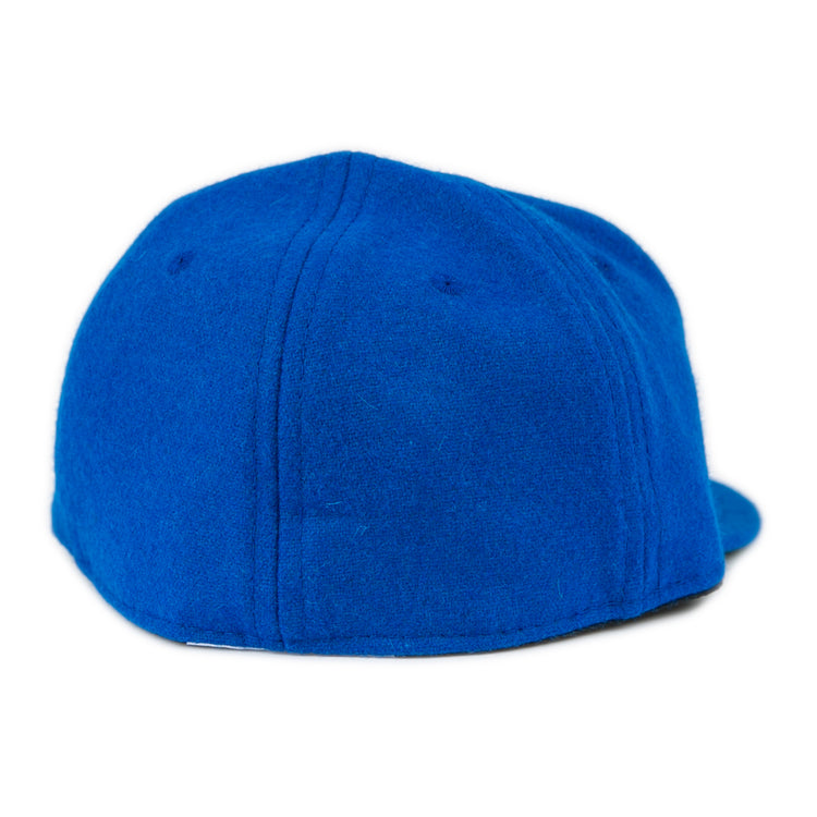 The Southern Methodist University 1962 Vintage Ballcap by EFF is a blue wool baseball cap shown from the back, featuring visible stitching and no logo or adjustment strap for a classic vintage look.