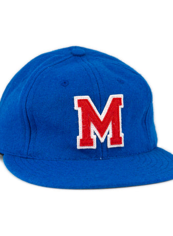 The EFF Southern Methodist University 1962 Vintage Ballcap is a blue wool cap featuring a large red M outlined in white on the front, reminiscent of classic SMU style, displayed against a plain white background.