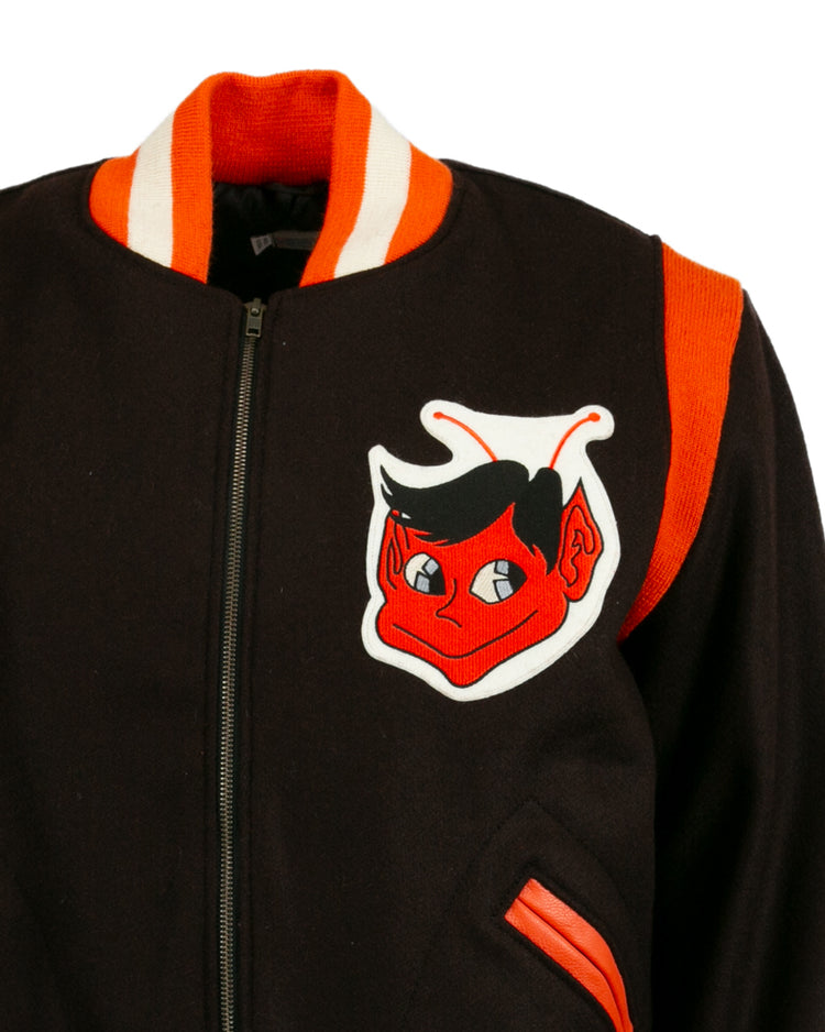 The EFF St. Louis Browns 1952 Authentic Jacket is a vintage wool baseball jacket with orange and white trim, a red cartoon devil patch on the chest, orange shoulder stripe, zip front, and orange-trimmed pockets.