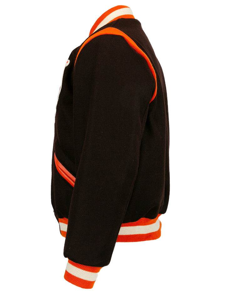 Side view of the EFF St. Louis Browns 1952 Authentic Jacket in black wool, featuring orange and white striped cuffs, collar, waistband, and orange trim along seams and pockets.