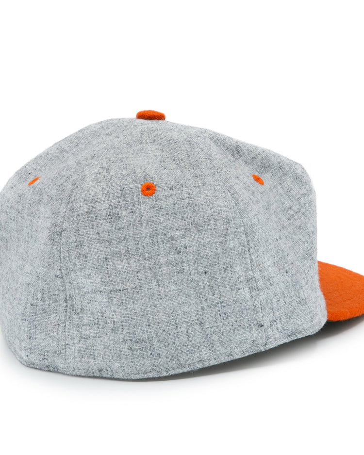 The Ebbets Field Flannels University of Tennessee 1962 Vintage Ballcap, featuring a gray crown, orange eyelets, a top button, and an orange brim, is displayed from the back against a white background.