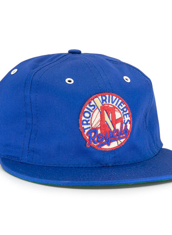 The EFF Trois Rivières Royals Cotton Twill Ballcap features a blue design, front round patch with bat and glove, white eyelets, green brim underside, and celebrates the Canadian-American League.