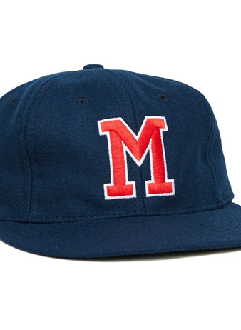 The University of Mississippi 1969 Vintage Ballcap by Ebbets Field Flannels is a navy wool cap with a flat brim and bold red and white M on the front, echoing the classic Ole Miss Rebels look from 1969.