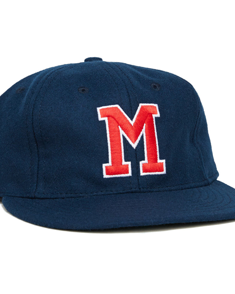 The University of Mississippi 1969 Vintage Ballcap by Ebbets Field Flannels is a navy wool cap with a flat brim and bold red and white M on the front, echoing the classic Ole Miss Rebels look from 1969.