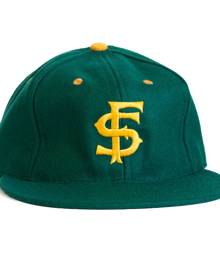 The EFF University of San Francisco 1950 Vintage Ballcap is a green wool hat with a yellow top button and yellow “SF” embroidery—perfect for any collegiate baseball cap collection.