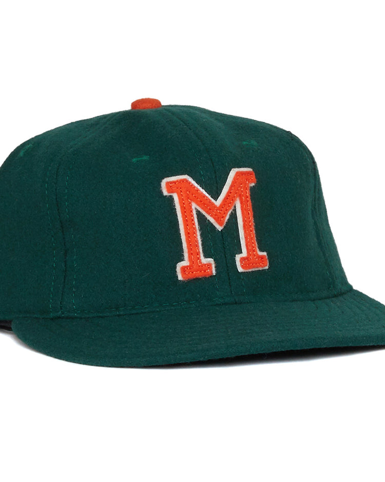 The EFF University of Miami 1958 Vintage Ballcap is a dark green cap with an orange button and a bold orange and white M on the front, inspired by a classic UM design.