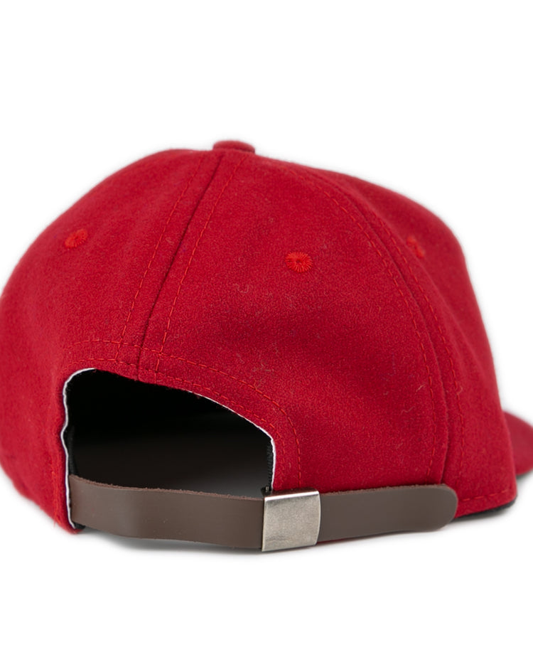 The EFF Virginia Tech 1963 Vintage Ballcap is a red wool baseball cap shown from the back, featuring an adjustable brown leather strap with metal clasp—an officially licensed Collegiate Vault classic.