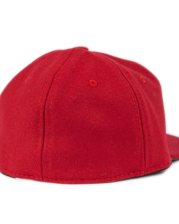 The EFF Virginia Tech 1963 Vintage Ballcap is shown from the back and side, featuring a plain red wool design, flat brim, visible stitching, and classic styling inspired by the Collegiate Vault collection.