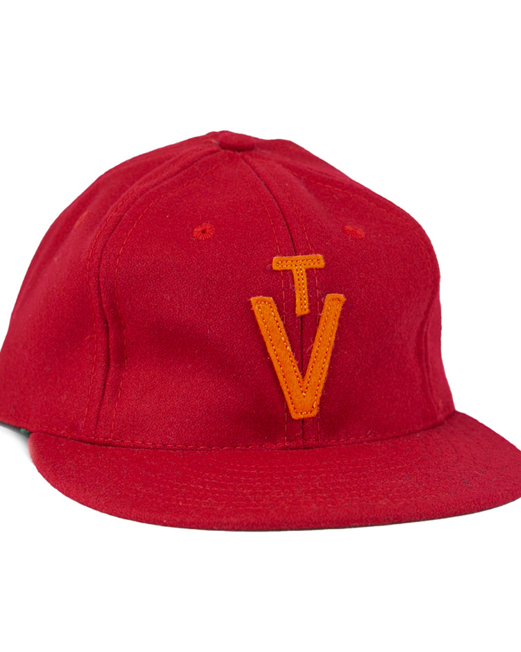 The EFF Virginia Tech 1963 Vintage Ballcap is a wool cap with a flat brim and an orange embroidered TV logo—an officially licensed Collegiate Vault product.