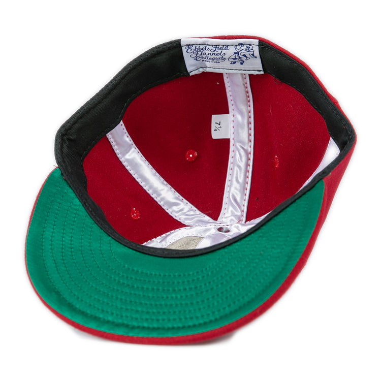 A red Virginia Tech 1963 Vintage Ballcap by EFF, turned inside out to show a green brim, white stitching, and an EFF label. The inner size tag reads 7 1/4. Inspired by the officially licensed Collegiate Vault.