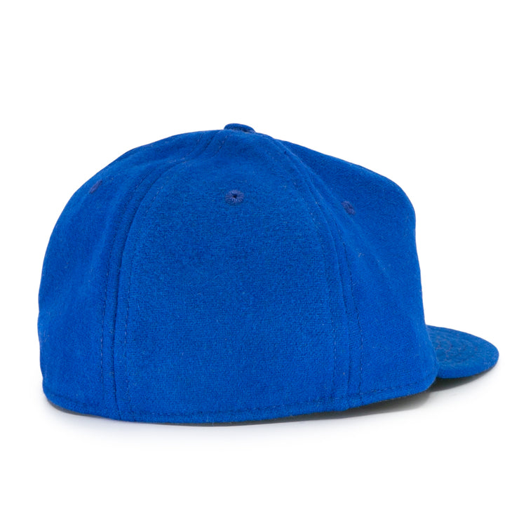 The EFF Wichita Falls Spudders 1956 Vintage Ballcap is shown from the back on a white background, featuring bright blue, soft textured fabric with a rounded crown and flat brim.