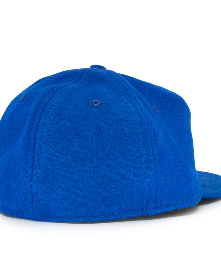 The EFF Wichita Falls Spudders 1956 Vintage Ballcap is shown from the back on a white background, featuring bright blue, soft textured fabric with a rounded crown and flat brim.
