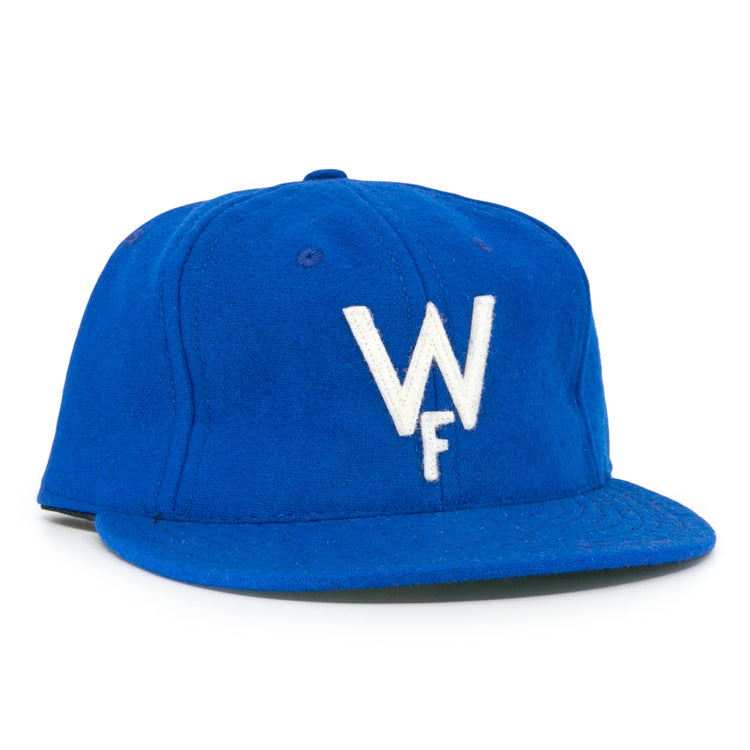 The Wichita Falls Spudders 1956 Vintage Ballcap by EFF is a royal blue wool baseball hat with a white embroidered W over F, classic structured design, and flat brim—perfect for true fans.