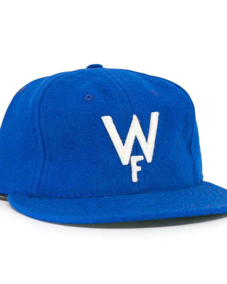 The Wichita Falls Spudders 1956 Vintage Ballcap by EFF is a royal blue wool baseball hat with a white embroidered W over F, classic structured design, and flat brim—perfect for true fans.