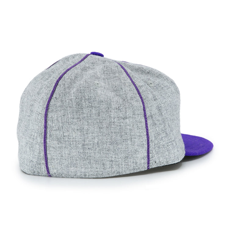 The EFF University of Washington 1938 Vintage Ballcap features gray fabric, purple stitching, and a purple brim. Shown from the back at an angle, its perfect for fans wanting a classic UW look.