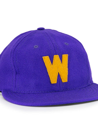 The EFF University of Washington 1950 Vintage Ballcap is a purple cap with a curved brim and a bold yellow W on the front, inspired by classic Huskies style.