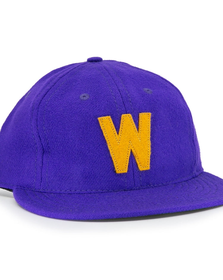 The EFF University of Washington 1950 Vintage Ballcap is a purple cap with a curved brim and a bold yellow W on the front, inspired by classic Huskies style.