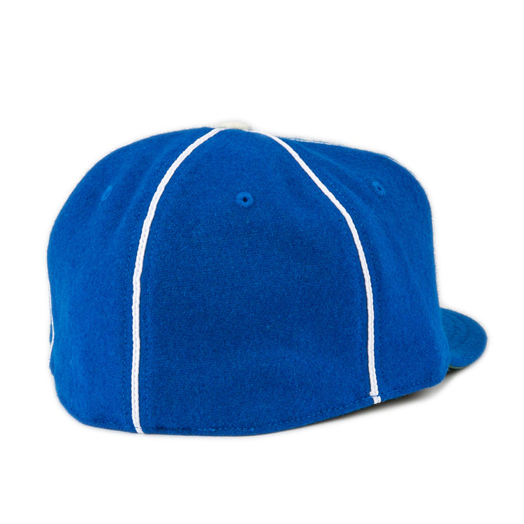 The EFF Wyoming State Penitentiary 1911 Vintage Ballcap is a royal blue cap with white vertical stitching, a flat brim on the right side, and is proudly made in the USA.