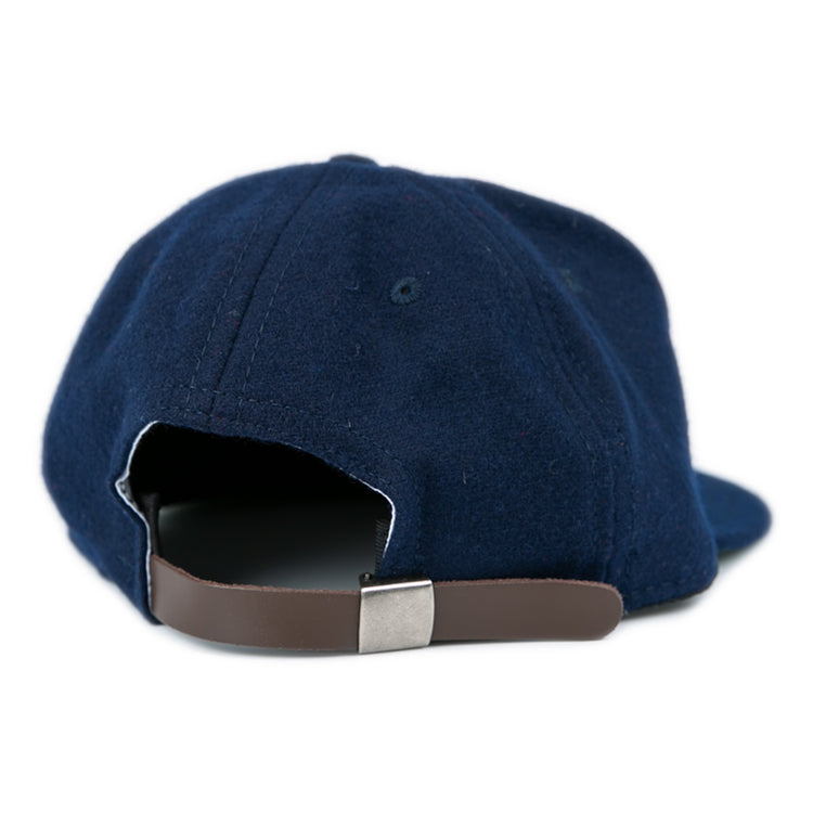 The West Virginia University 1966 Vintage Ballcap by Ebbets Field Flannels is a navy blue cap with a brown adjustable strap and silver buckle, capturing the classic style of the ’66 Mountaineers.