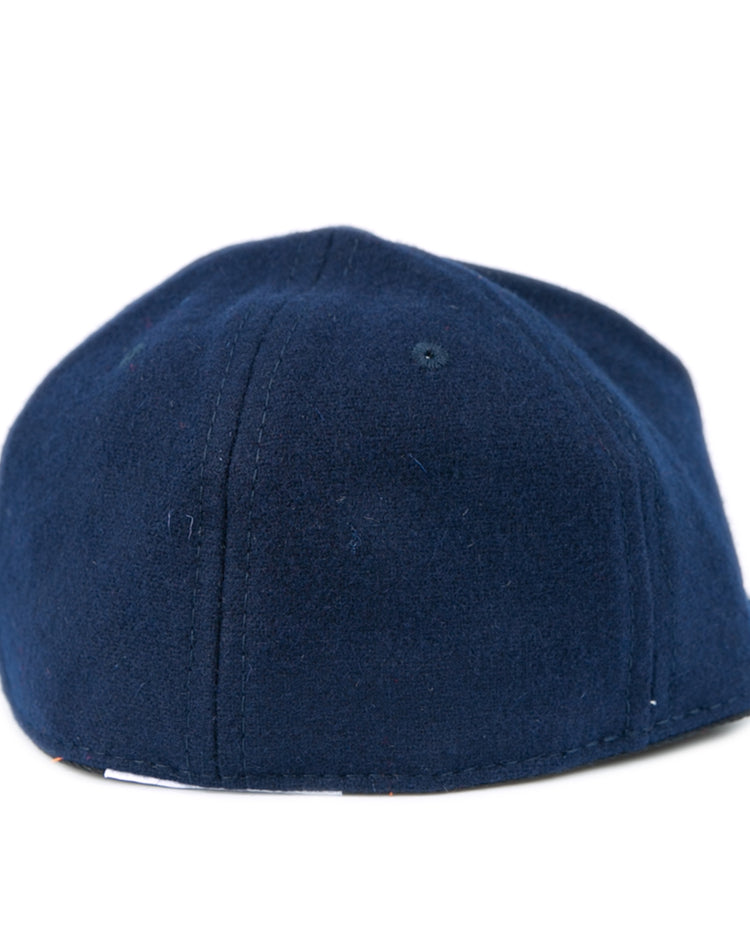 The Ebbets Field Flannels West Virginia University 1966 Vintage Ballcap features navy blue wool, visible stitching, and a gently curved shape, capturing the classic look of the original Mountaineers cap from 1966.
