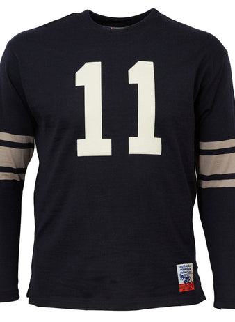 The EFF Yale University 1956 Authentic Football Jersey is a black long-sleeve shirt with beige sleeve stripes, a large white 11 on the front, and a small patch near the hem, inspired by historic Yale football style.