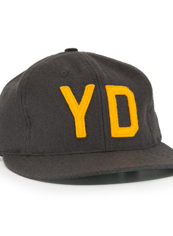 The EFF Young Democrats 1972 Vintage Inspired Ballcap is a dark grey wool six-panel cap with a curved brim and yellow Y and D embroidery, capturing classic Little League baseball style.