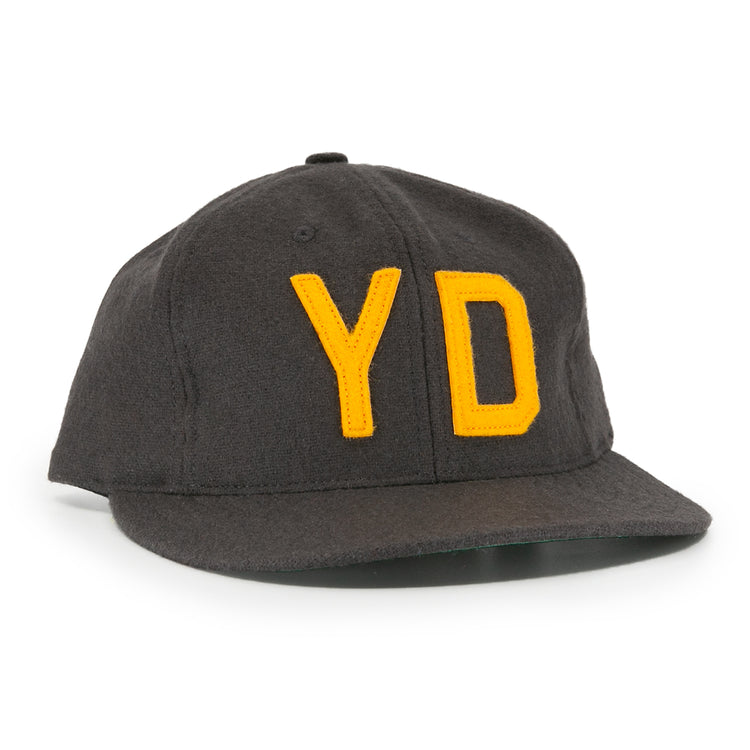 The EFF Young Democrats 1972 Vintage Inspired Ballcap is a dark grey wool six-panel cap with a curved brim and yellow Y and D embroidery, capturing classic Little League baseball style.