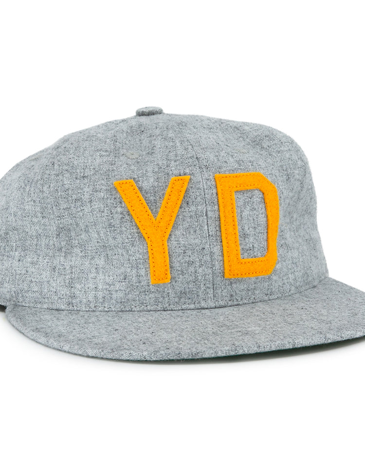 The EFF Hoboken Young Democrats 1972 Vintage Ballcap is a gray wool hat with bold yellow Y and D letters, inspired by the classic Little League style and the original 1972 Hoboken Young Democrats cap.